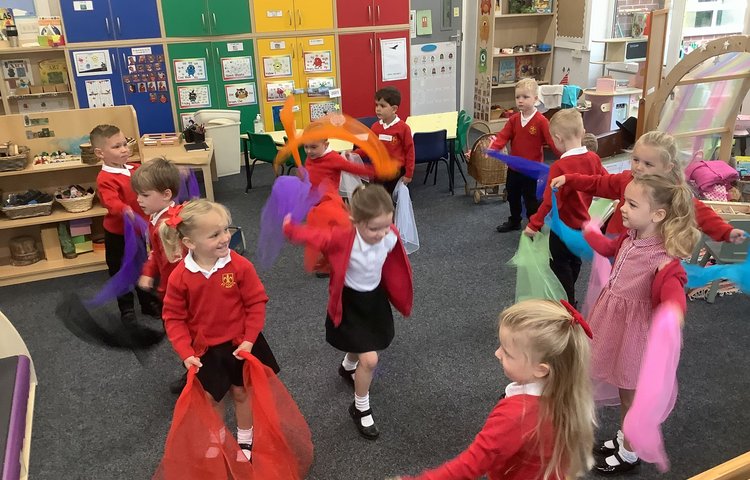 Image of Scarf dancing to develop our gross motor skills! 